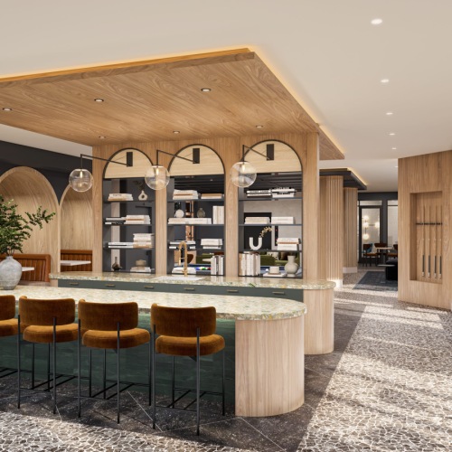 a large room with a bar and chairs