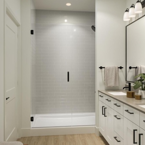 a bathroom with white cabinets